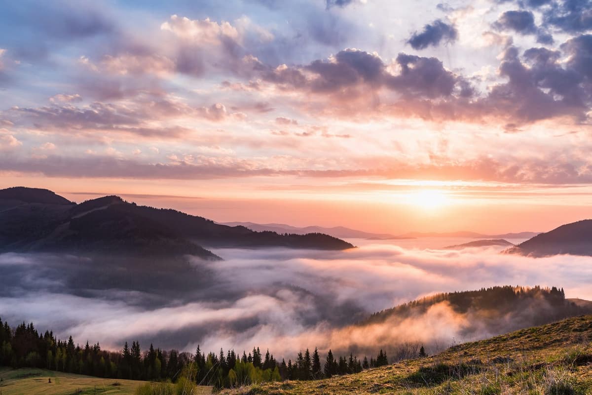 Sunrise over a sea of cloud filling the valleys below the ridge on the Kulekhani and Daman tour