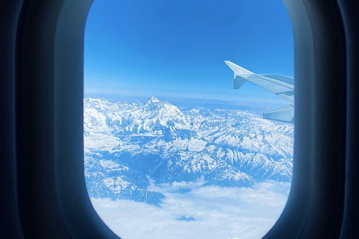 Everest and the Himalaya through a passenger window on the Everest mountain flight