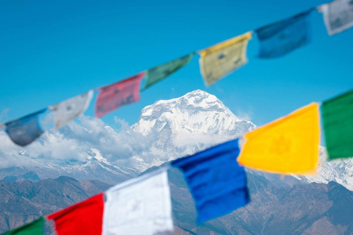 Prayer flags in front of Dhaulagiri on the Annapurna Base Camp and Poon Hill trek from Kathmandu