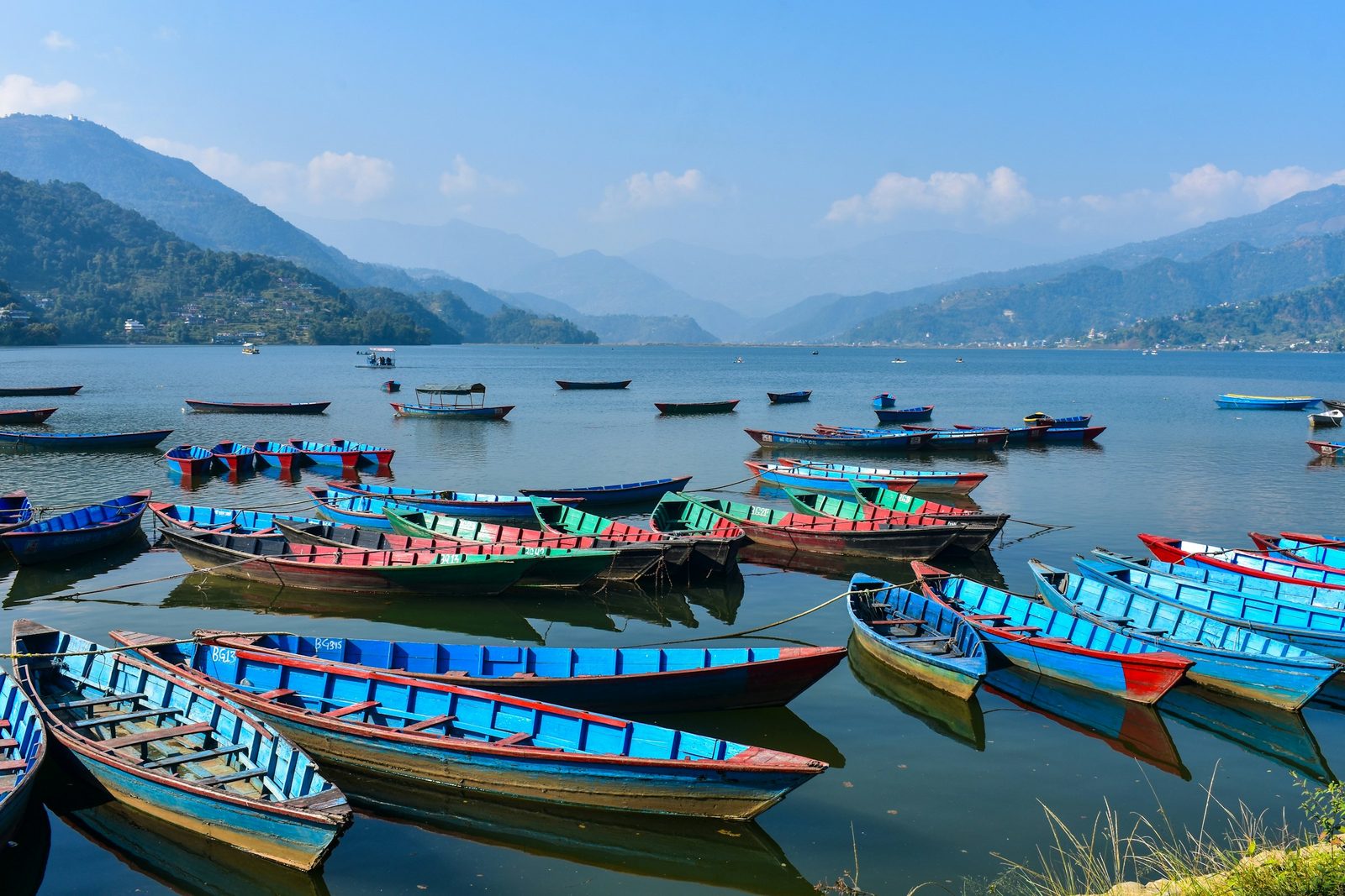 Colourful rowing boats on Phewa Lake, Pokhara, on the Bandipur Pokhara Kathmandu tour