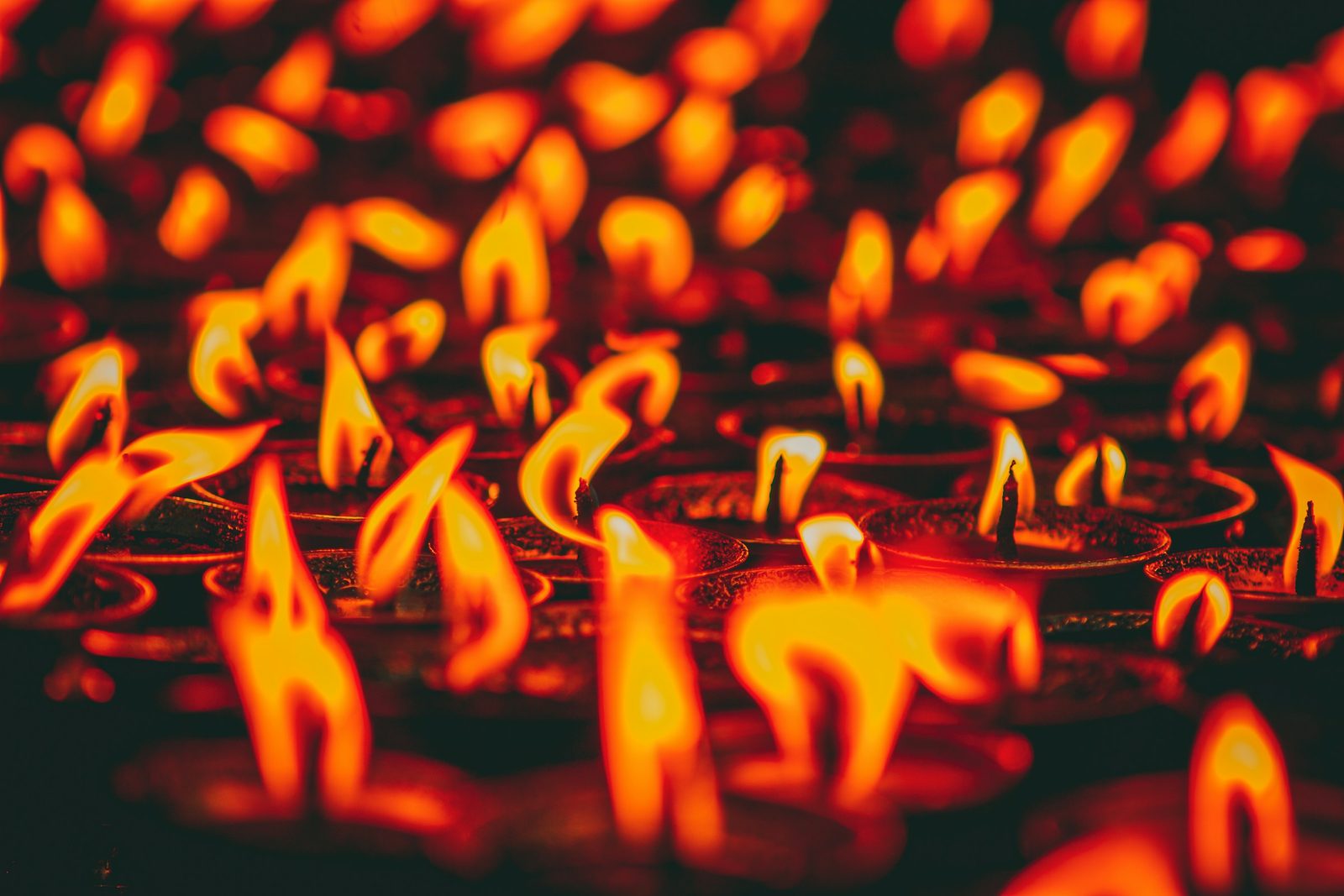 Butter lamps burning in a monastery on the day in the monasteries tour of Kapan, Pharping and Dakshinkali