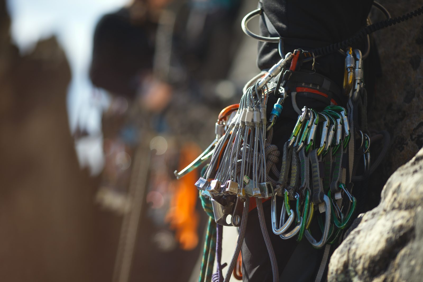 Quickdraws and carabiners on a climbing harness, the gear available to hire for a day of rock climbing near Kathmandu.