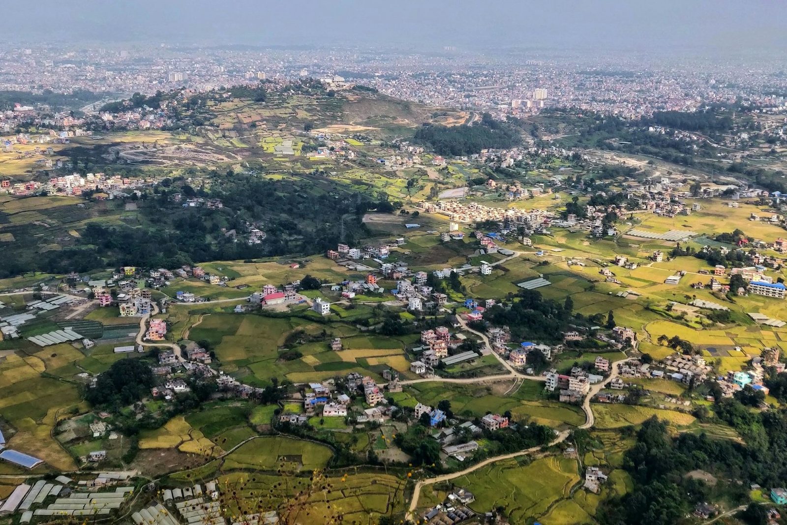 Terraced fields and villages of the Kathmandu Valley from above, the kind of view you get on the Tarebhir hike.
