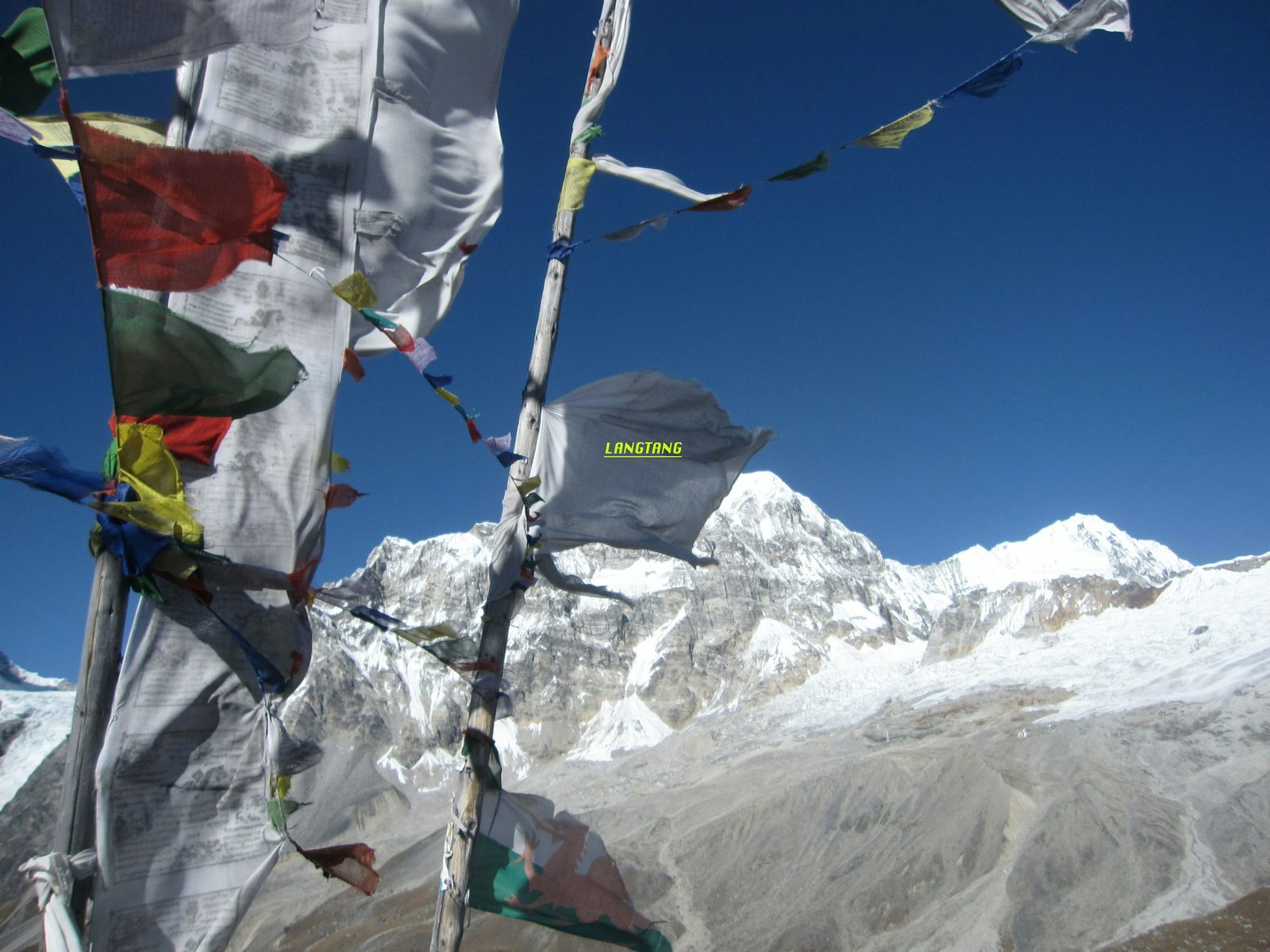 Prayer flags in front of a snow peak at Kyanjin on the Langtang Valley trek