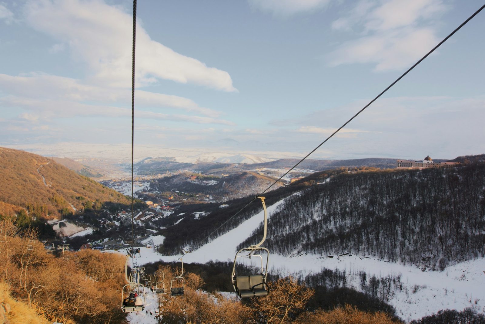 A cable car gondola crossing a snowy forested valley, the ride up on the Kalinchowk with Palanchowk Bhagwati tour