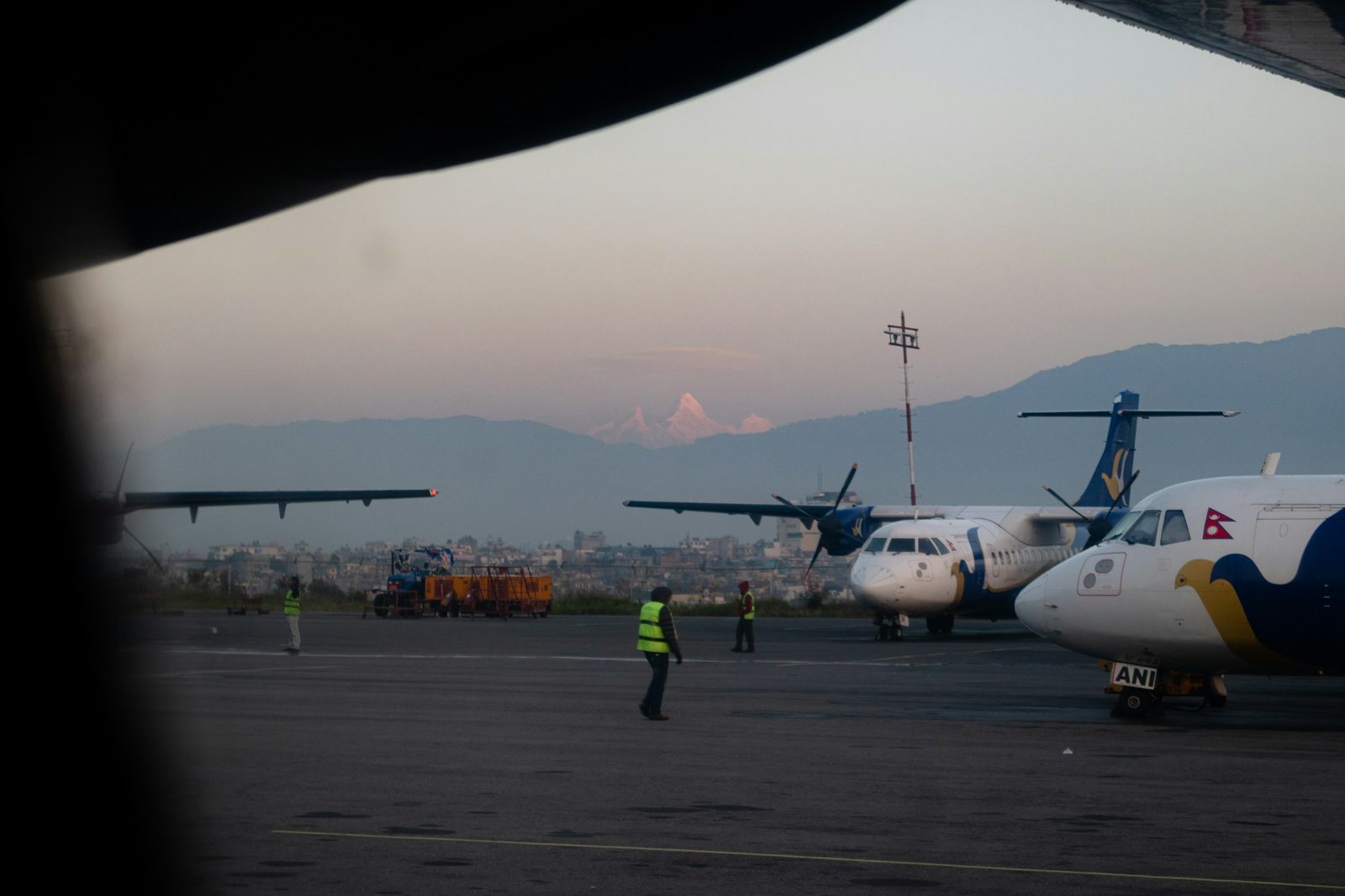 Turboprop aircraft on the apron at Kathmandu airport before the Everest mountain flight