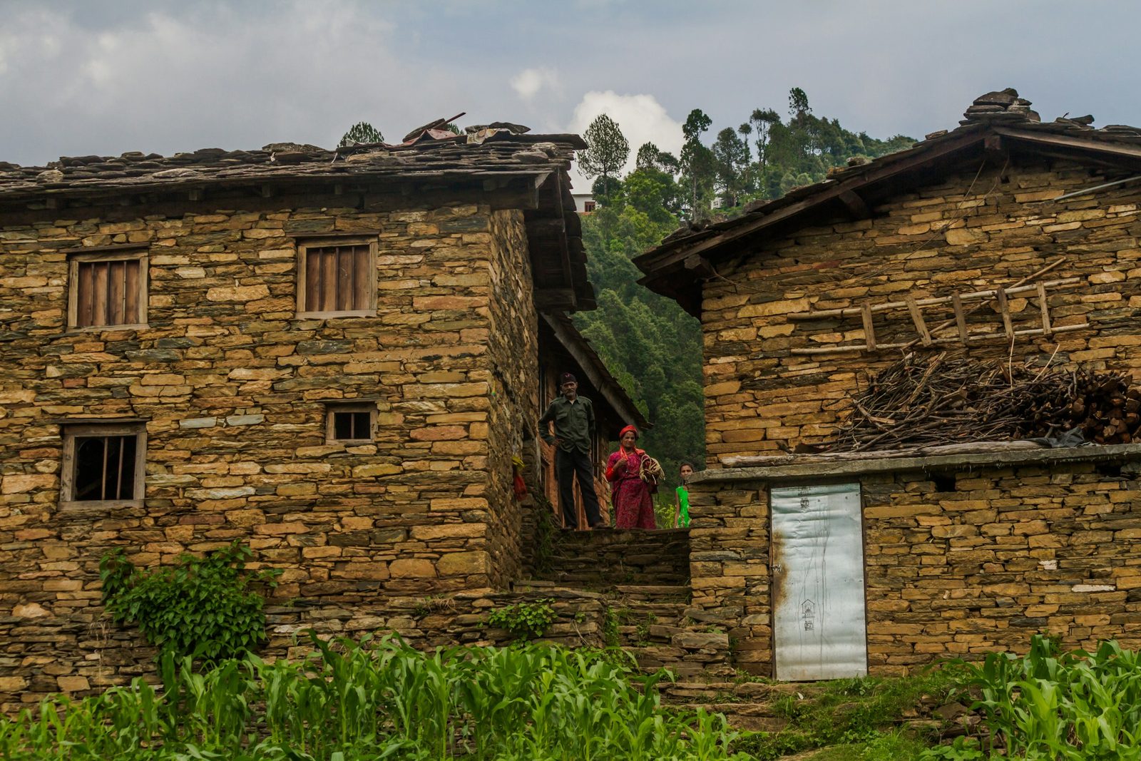 A traditional stone and timber Tamang house in a mountain village on the Tamang Heritage Trail and Langtang Valley trek