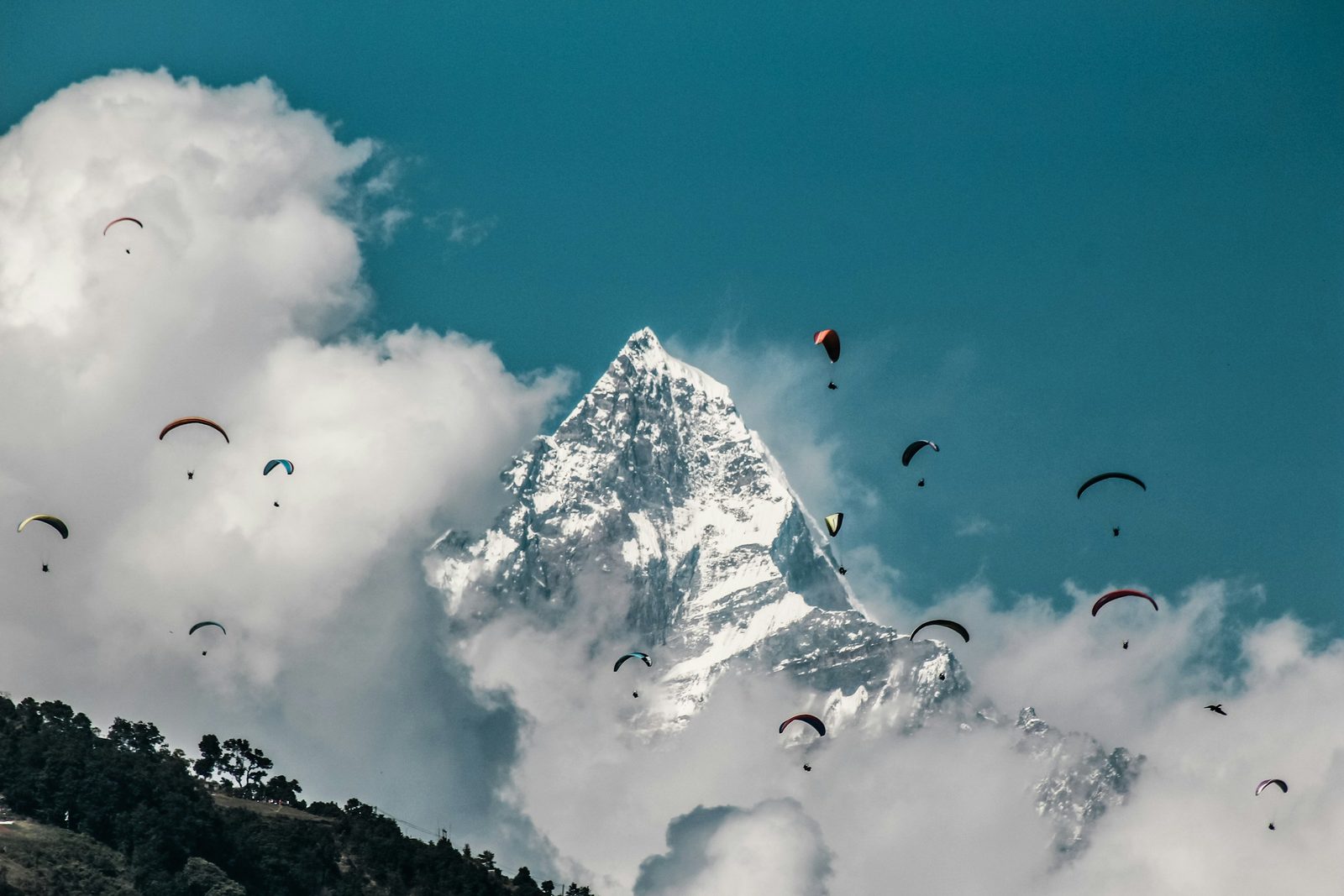 Paragliders in the sky above Machhapuchhre near Pokhara, Nepal