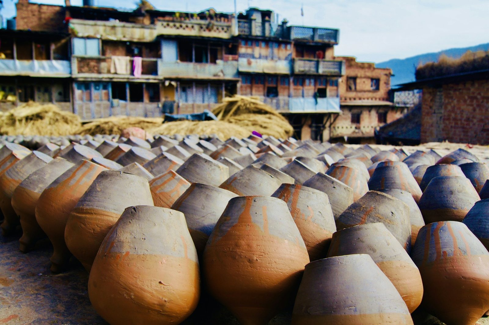 Clay pots drying in the sun in Bhaktapur, the pottery tradition you meet on the Nepali cooking class.